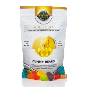 Colorful CBD gummy bears in front of a branded white and yellow pouch.